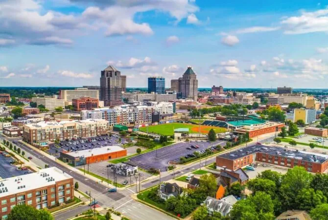 Greensboro city skyline with modern buildings and downtown view at sunset